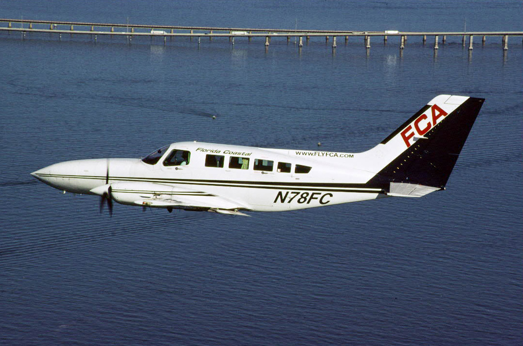 Florida Coastal began flying in 1995 with routes from the Florida mainland to the Keys and the Bahamas using a fleet of 9-passenger Cessna 402s. The carrier was based at Ft. Pierce, Florida.  Cessna 402 N78FC is seen flying above the 7 Mile Bridge in the Florida Keys, circa 2004.