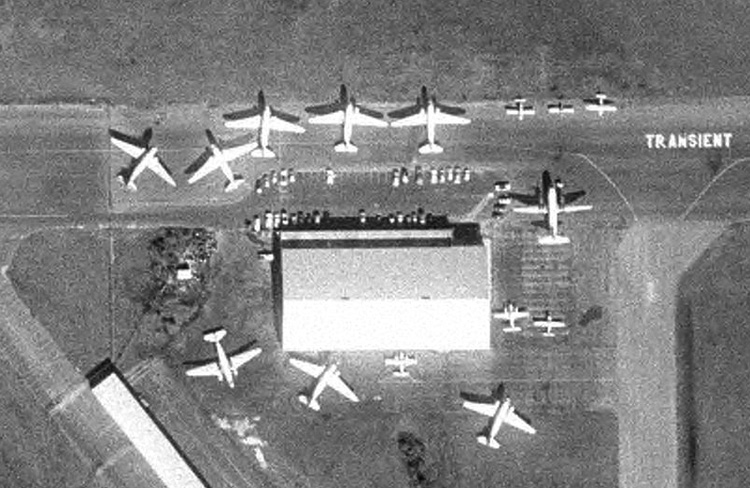 Eight DC-3s and a Martin 404 are among the many aircraft parked at the Florida Airlines maintenance base in Sarasota in this December 7, 1977 Department of Transportation aerial photo.