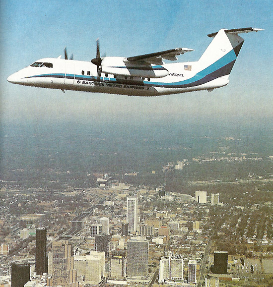 Eastern Metro Express De Havilland Canada Dash 8 N800MX above downtown Atlanta in 1986.