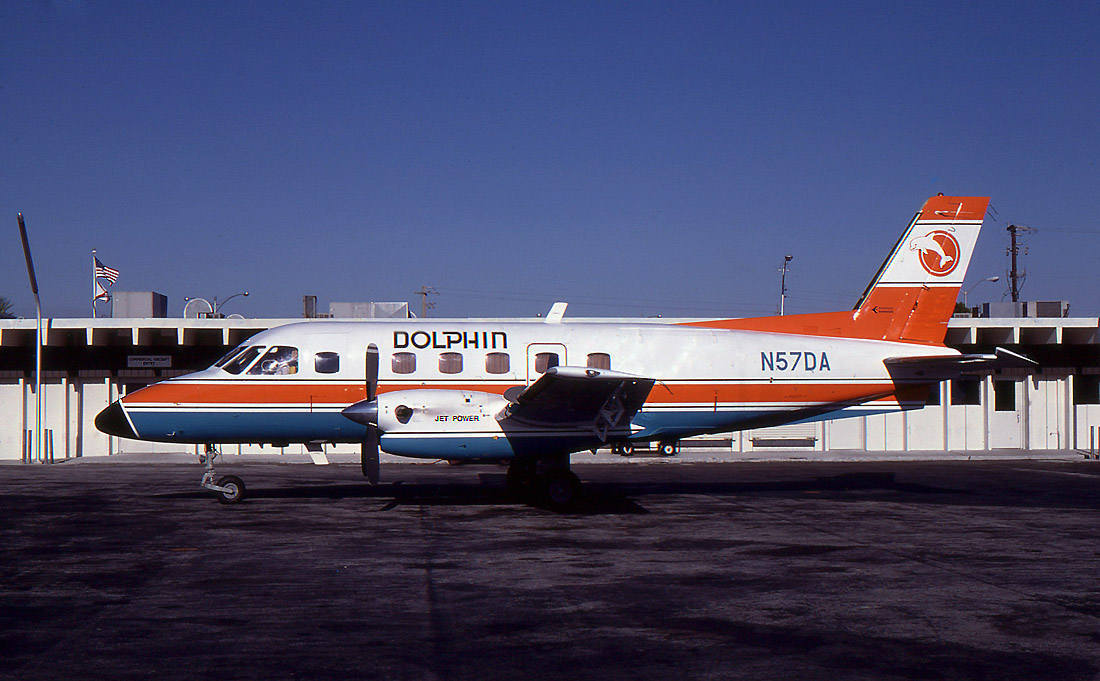 Embraer Bandeirante EMB-110 N57DA in the classic orange and turquoise colors of Dolphin Airlines.