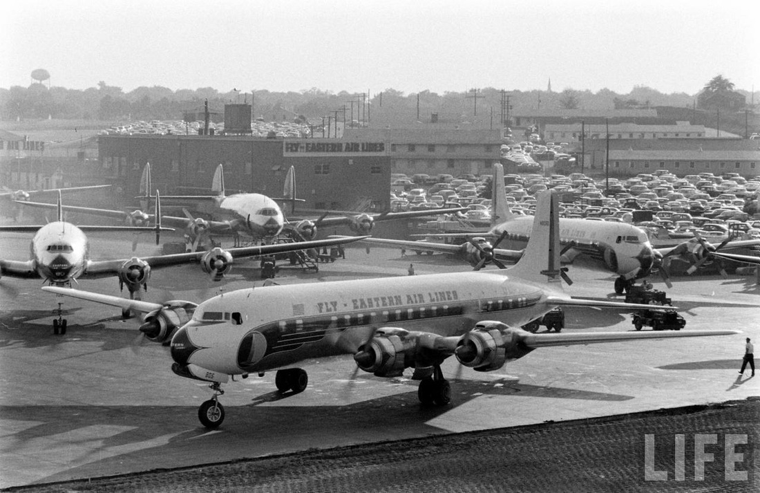 A shiny new Eastern Air Lines Douglas DC-7 heads for the taxiway at Atlanta in 1956.