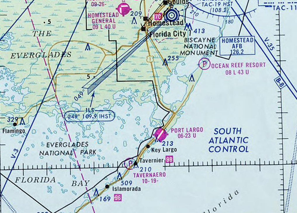 Port Largo Airport is seen at the center of this February 1976 Miami sectional chart and is shown as having a single 2,300' paved northeast/southwest runway.